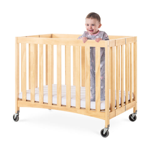 #48394 Compact Travel Sleeper™ Folding Crib, Slatted w/ Oversized Casters (Foam Mattress)